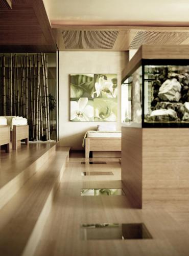 a living room with a couch and a table at SPA & Relax Hotel Erika in Tirolo