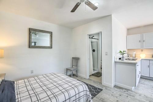 a bedroom with a bed and a sink and a mirror at Cozy Lompoc Studio with Patio about 9 Mi to Beach in Lompoc