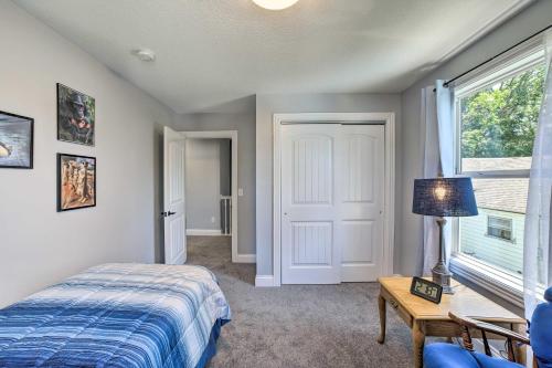 a bedroom with a bed and a table and a window at Fort Wayne Getaway - Family and Pet Friendly! in Fort Wayne
