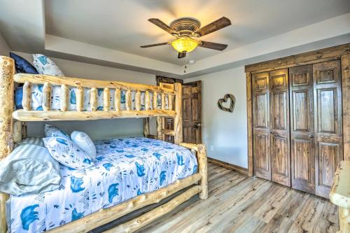 a bedroom with a bunk bed and a ceiling fan at Hot Tub and Mtn View Cripple Creek Retreat! in Cripple Creek