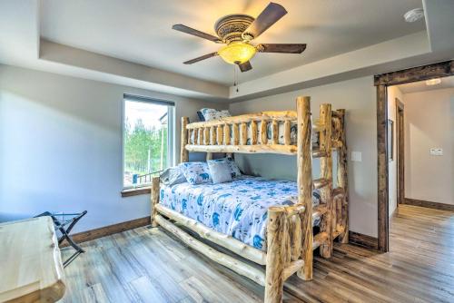 a bedroom with a bunk bed and a ceiling fan at Hot Tub and Mtn View Cripple Creek Retreat! in Cripple Creek