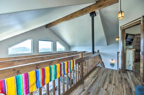a group of colorful towels on a wooden railing in a room at Hot Tub and Mtn View Cripple Creek Retreat! in Cripple Creek
