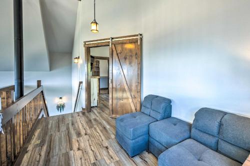 a living room with a couch and a chair at Hot Tub and Mtn View Cripple Creek Retreat! in Cripple Creek