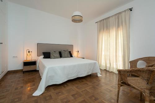 Un pat sau paturi într-o cameră la Villa Santa Maria Playa Grupo AC Gestion