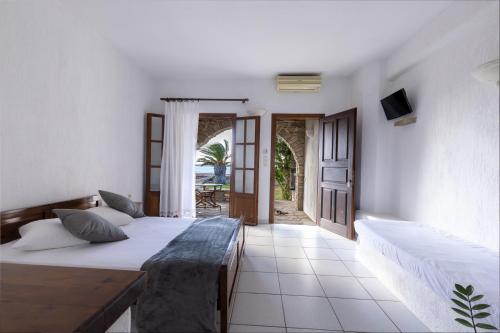 Una cama o camas en una habitación de Sunset Pounda
