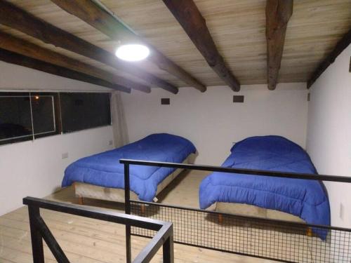 Posteľ alebo postele v izbe v ubytovaní VILLA DE MONTAÑA LOS CHACAYES, Manzano Hitorico, Caminos del vino, ruta 94