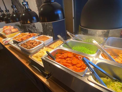 a buffet line with many different types of food at The Crown Fakenham in Fakenham