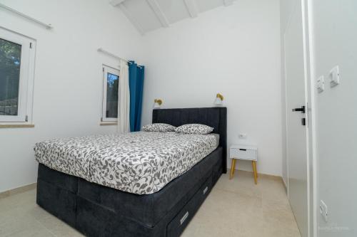 Postel nebo postele na pokoji v ubytování STONE HOUSE LEANI