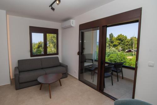 a living room with a couch and a table at Zia Apartments in Bar