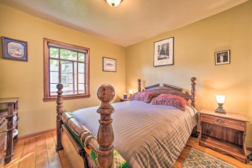 a bedroom with a bed and a window at Sault Ste Marie Historic Home, Walk to Town! in Sault Ste. Marie