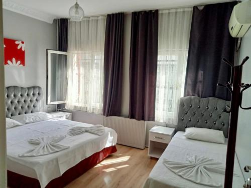 Ένα ή περισσότερα κρεβάτια σε δωμάτιο στο Sultan Hostel & Guesthouse