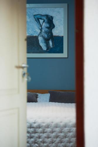 a picture of a dog sitting on a bed at Domus Maritima in Trogir