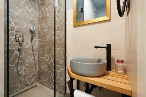 a bathroom with a sink and a shower at Domus Maritima in Trogir