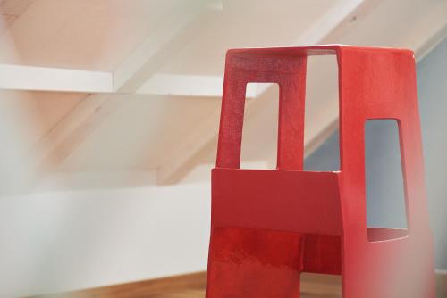 a red vase sitting on the floor in a room at Domus Maritima in Trogir
