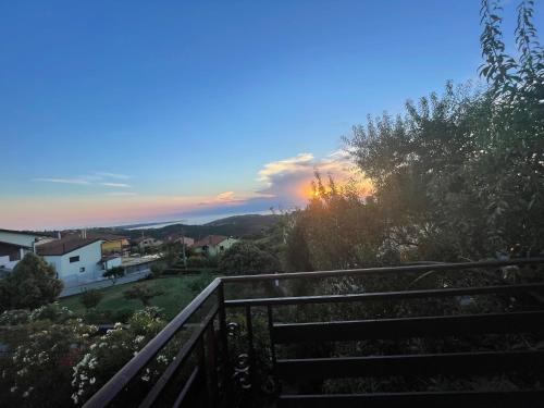 a sunset from the balcony of a house at Hiša Ivančič in Šared