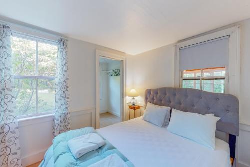 a bedroom with a large bed and a window at Beachroad Hideout in Lobsterville