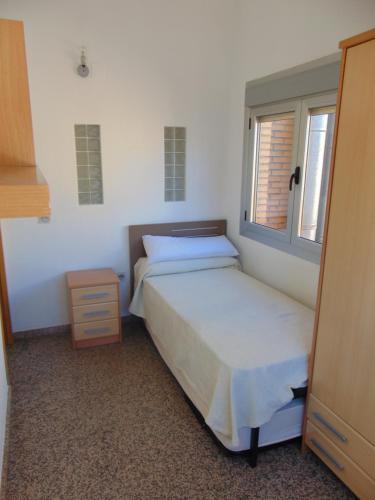 A bed or beds in a room at Penthouse overlooking Cuenca