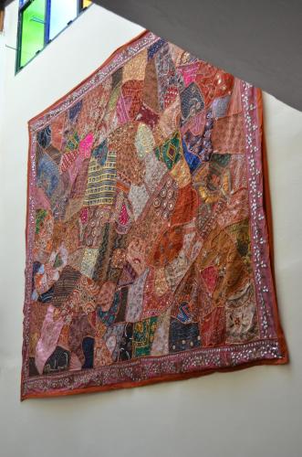a quilt hanging on a wall at Riad Selma in Meknès