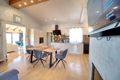 a kitchen and dining room with a table and chairs at Villa Absolute privacy in Novigrad Istria