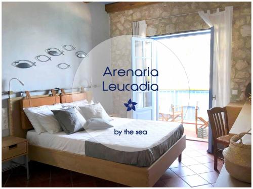 a bedroom with a bed with a sign on it at Arenaria Leucadia in Agios Nikitas