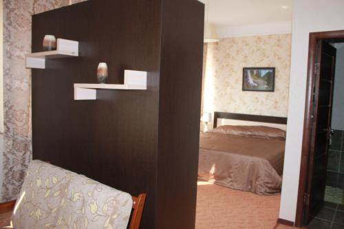En eller flere senge i et værelse på Hotel Laeti-Zhaiyk