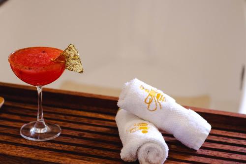 a drink and a rolled up towel and a napkinolitics at GALA Hotel Boutique in Guadalajara
