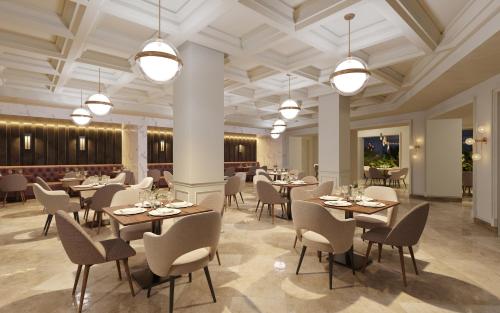 a restaurant with tables and chairs and lights at Hyatt Zilara Riviera Maya Adults Only All-Inclusive in Playa del Carmen