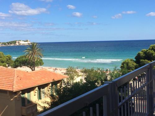 a view of the beach from the balcony of a condo at Mondello Luxury Apartment on the Beach in Mondello