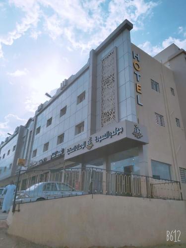 a building with a car parked in front of it at جولدن السودة in Abha