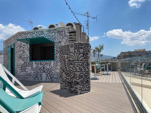 a building with a black and white pattern on it at Evripides Hotel in Athens