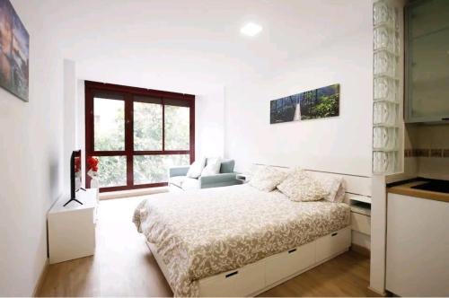 Ένα ή περισσότερα κρεβάτια σε δωμάτιο στο Apartamento Las Palmas