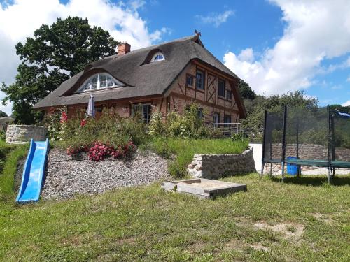 a house sitting on top of a green field at Ferienwohnung Böttcher in Putbus