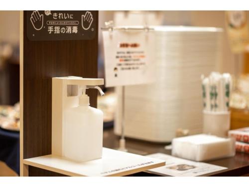 a bottle of lotion sitting on top of a counter at AZ INN HANDA INTER - Vacation STAY 69371v in Handa