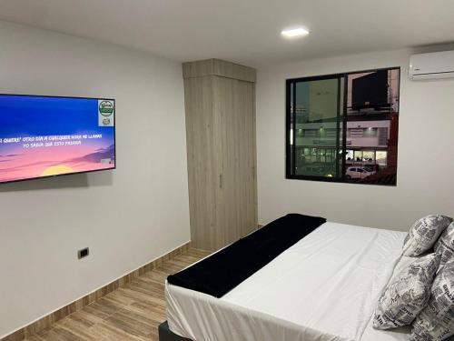 Cama o camas de una habitación en Aparta Suites 404 Granada Cali