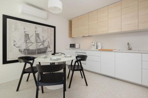 Η κουζίνα ή μικρή κουζίνα στο Porta Mare Apartamenty Słoneczne Tarasy