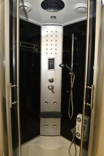 a bathroom with a shower with a glass door at Dreams tivat in Tivat