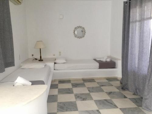 Ένα ή περισσότερα κρεβάτια σε δωμάτιο στο Rodia Studios & Apartments