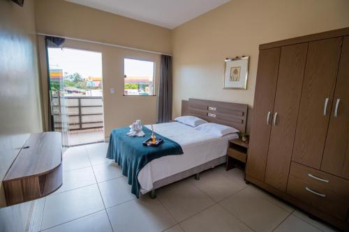 Ένα ή περισσότερα κρεβάτια σε δωμάτιο στο Hotel Flor de Lotus