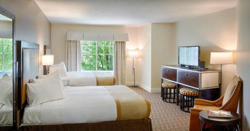 מיטה או מיטות בחדר ב-Grand Canyon Railway Hotel