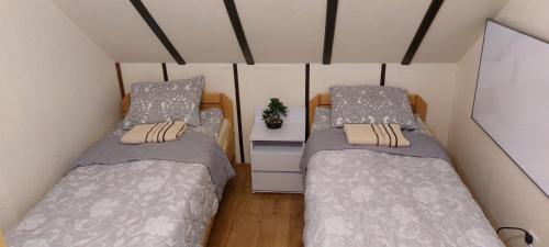Кровать или кровати в номере Domek u Hołąbków