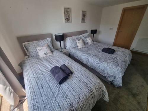 מיטה או מיטות בחדר ב-Dartford Lodge