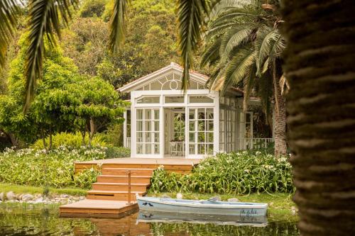 a small house with a boat in front of it at Villa Bokeh Relais & Châteaux in Antigua Guatemala