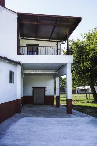 a large white building with a balcony on top at CASA DIEGO in Monforte de Lemos