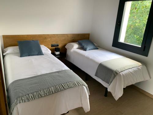 Postel nebo postele na pokoji v ubytování Cal Rufiandis