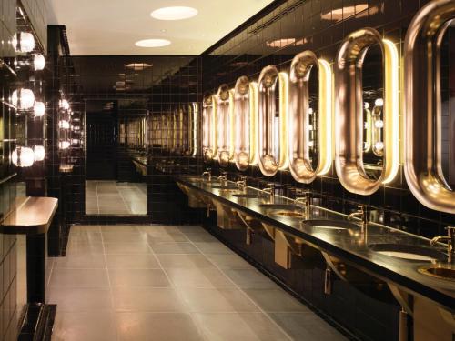 a row of sinks in a public restroom at Sea Containers London in London