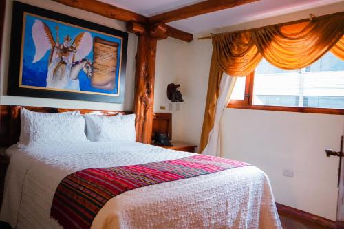 Säng eller sängar i ett rum på Hotel Maderanegra By Huasicama