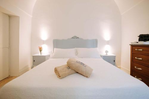 Ένα ή περισσότερα κρεβάτια σε δωμάτιο στο Villa Sardella