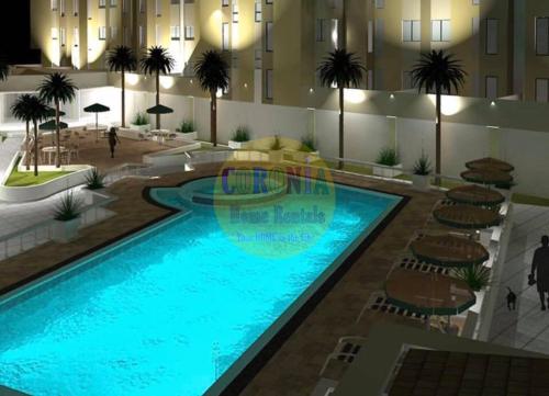 a swimming pool in the middle of a building at Isabelle De Valenzuela Condo Staycation in Marulas Valenzuela in Manila