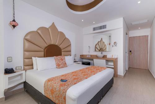Postel nebo postele na pokoji v ubytování Hotel Cartagena Dubai