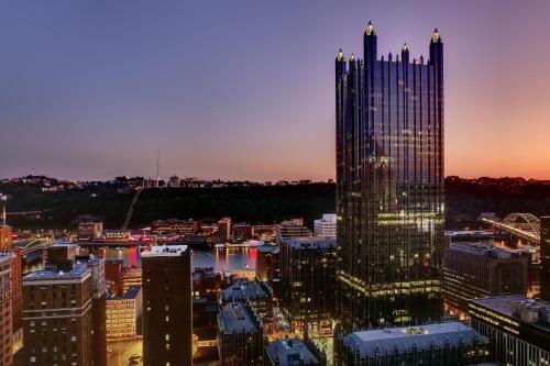 a view of a city skyline at night at Fairmont Pittsburgh in Pittsburgh